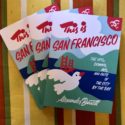 This is San Francisco books fanned out over a colorful tablecloth