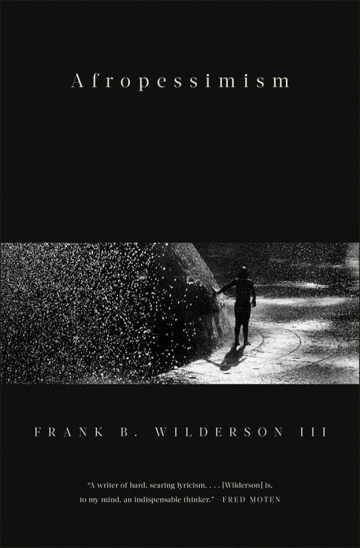 mostly black cover with a banner photograph of a person running a hand through a fountain 