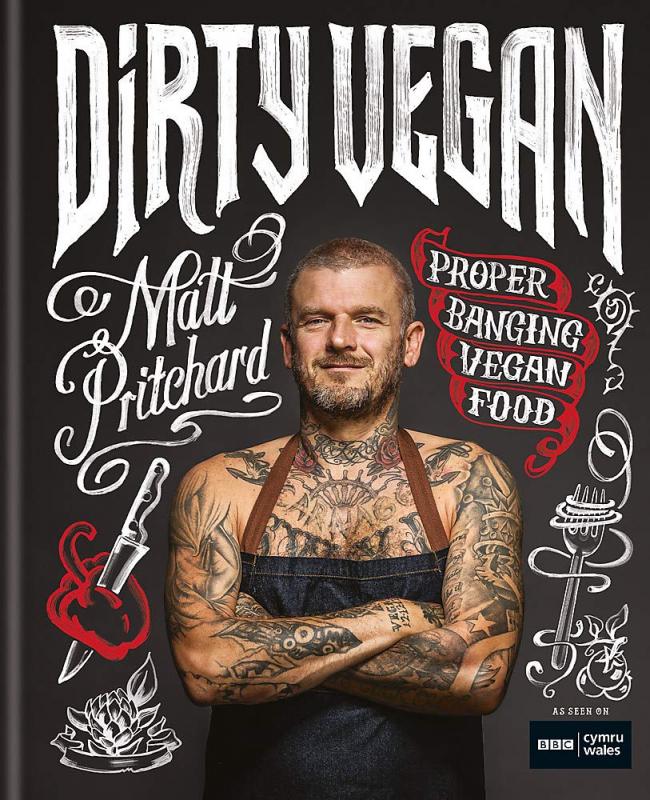 Cover with photo of the tattoo-covered author wearing an apron.