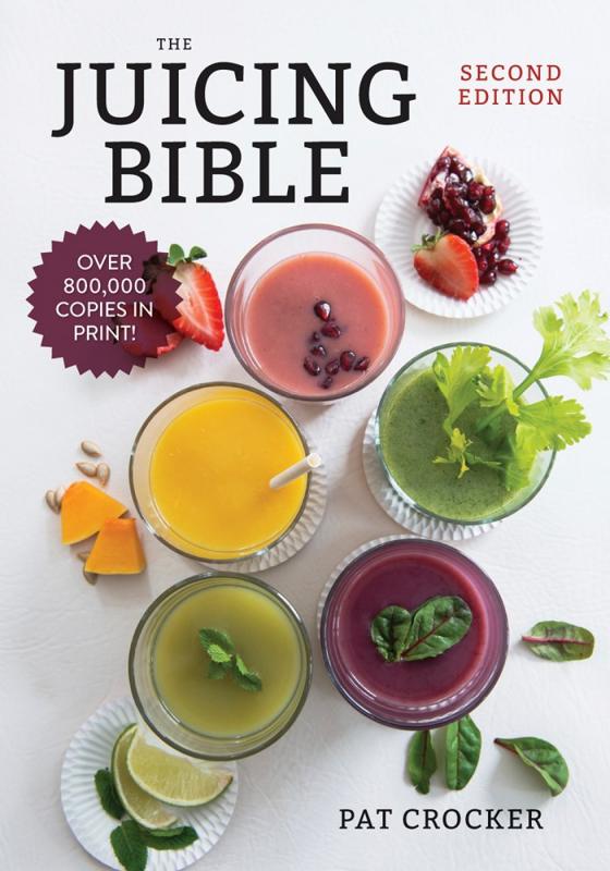 Photo of a white table viewed from the top with a variety of different juices and smoothies in glasses.