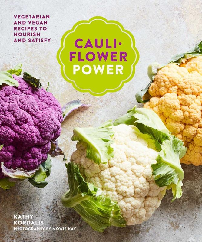 Purple, white, and orange cauliflower on grey background.