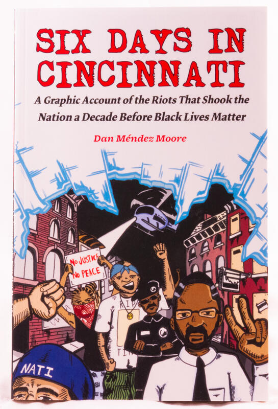 Angry people protest in the streets of Cincinnati with a helicopter flying overhead