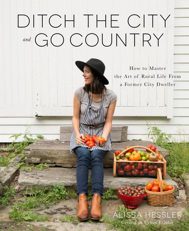 Alissa sitting on some steps with baskets of produce.