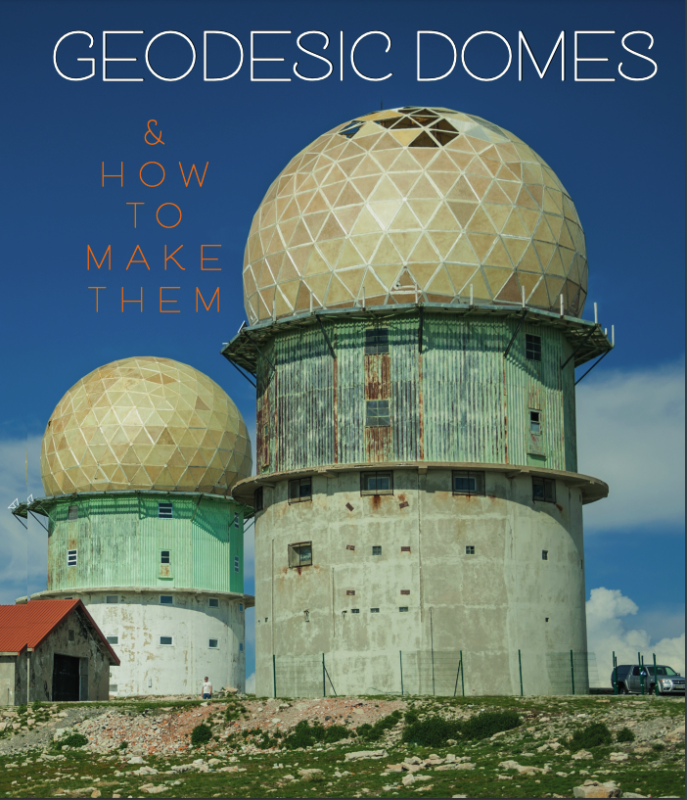 photo of two geodesic domes against a blue sky.