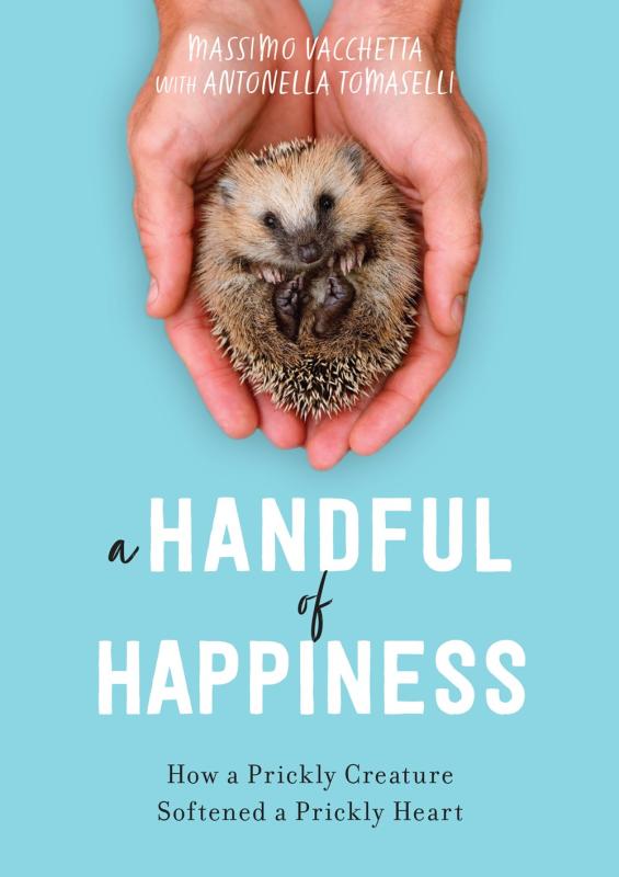 Blue cover with white font and at the top a photo of two hands holding a small hedgehog.