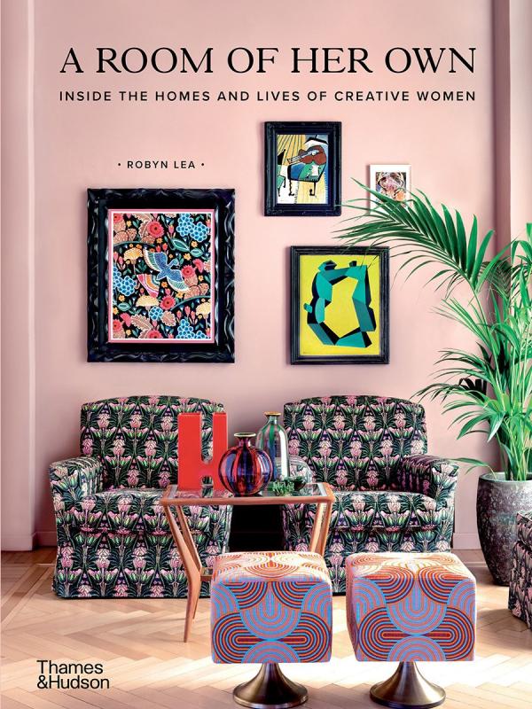 pink cover with chairs and picture frames on walls with black text