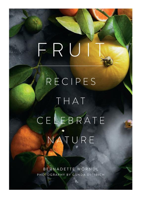 Leafy citrus fruits on a countertop