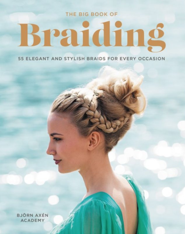 a white woman with an elaborate braided beehive