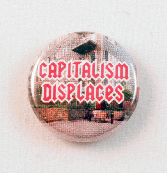 Capitalism displaces button