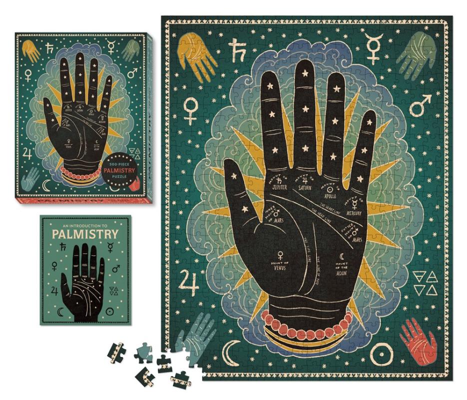 hand on green cover with stars and various other symbols