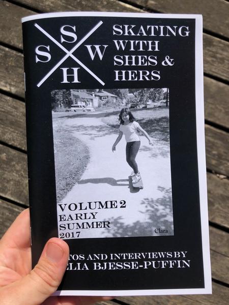 a photo of a woman skateboarding down a hill