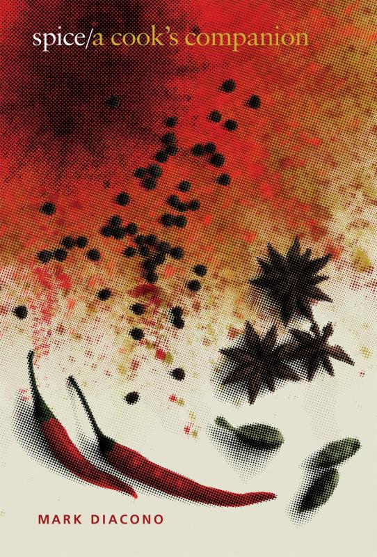 close up of spices splayed out o a white table with red text