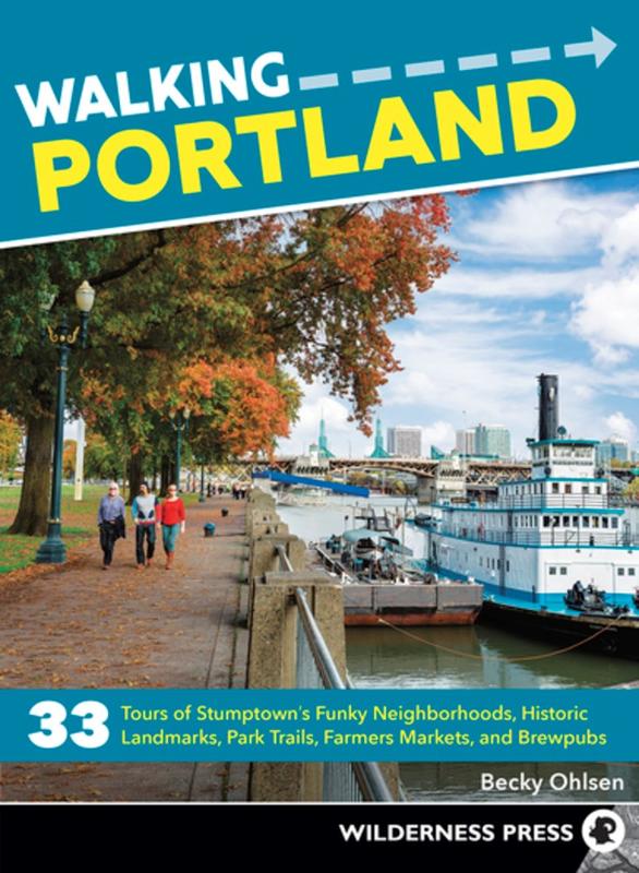 Portland's Willamette River with a ferry on it and people walking on the side of the river